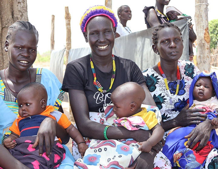 Mothers and their babies waiting for nutrition services at Maliai Primary Health Care Unit in Gogrial East, Warrap State. (South Sudan, 2024)