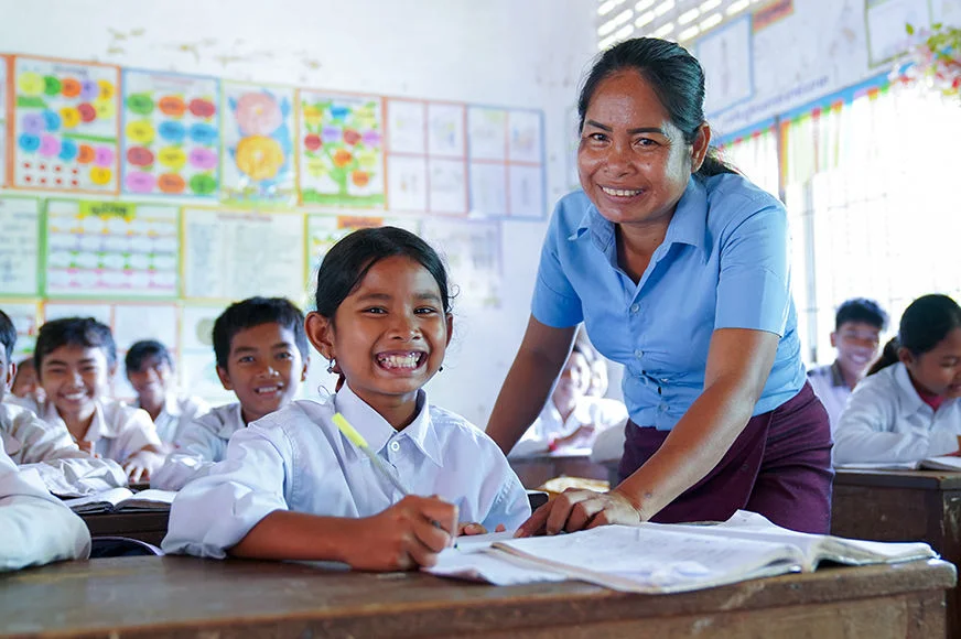 A girl enjoys her class in Cambodia. Through child sponsorship, she has learned about education, health, and child protection. She dreams of becoming a doctor. (Cambodia, 2022) 